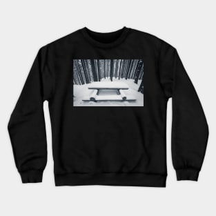 Wooden bench and table covered with snow among winter forest Crewneck Sweatshirt